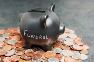 stock-photo-19119641-funeral-piggy-bank-on-coins